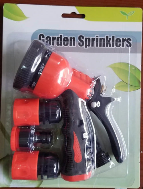 All metal garden spray gun with zinc alloy build and green handle held near potted plants