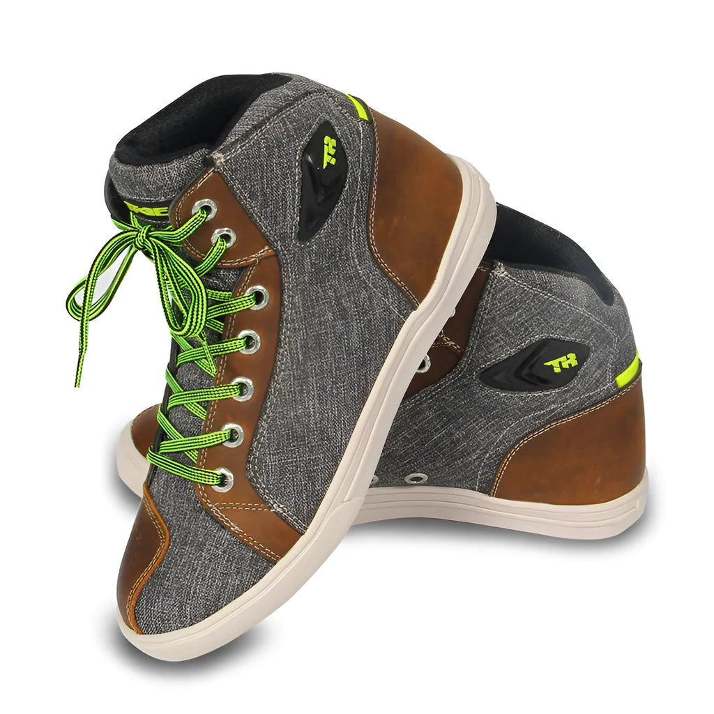 Black Tiger Boots motorcycle casual shoes with mesh panels and reinforced heel on a motorcycle footpeg.