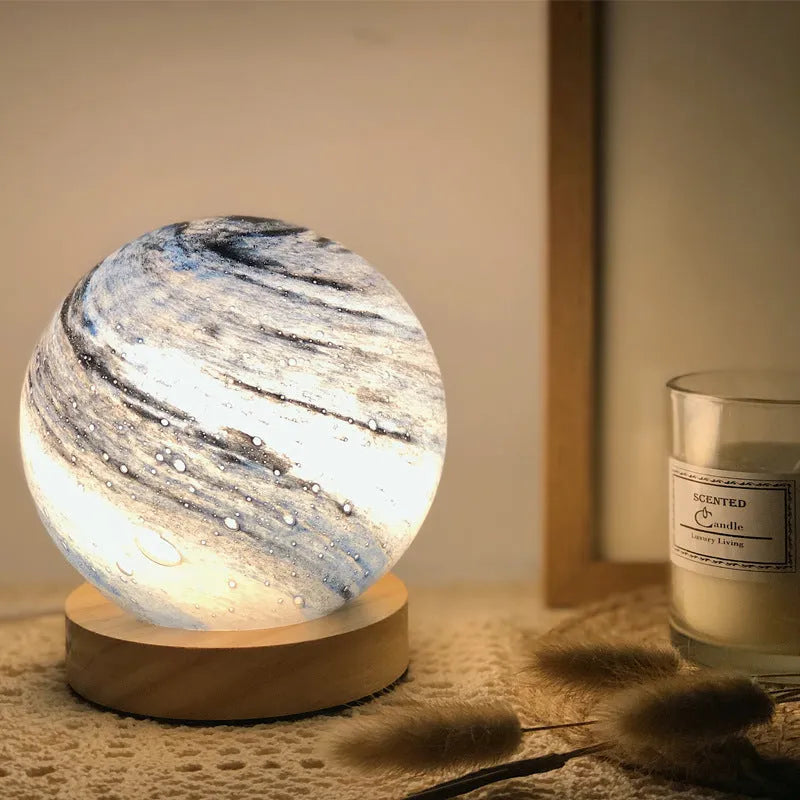 Girl Heart Nordic style glass table lamp in chosen colour with USB cable and button switch on bedside table.