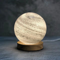 Girl Heart Nordic style glass table lamp in chosen colour with USB cable and button switch on bedside table.