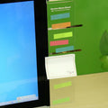 Clear acrylic computer monitor side pane 28cm x 7.8cm with sticky notes attached