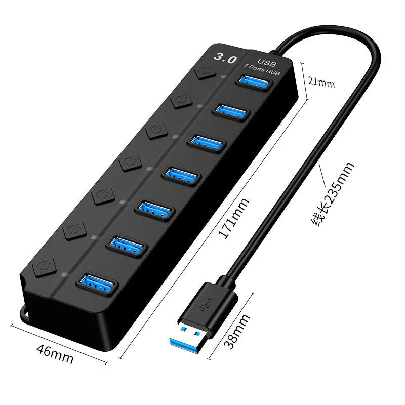 Black 7-port USB 3.0 hub with external power adapter on a wooden desk