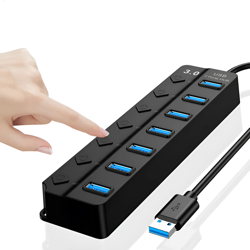 Black 7-port USB 3.0 hub with external power adapter on a wooden desk