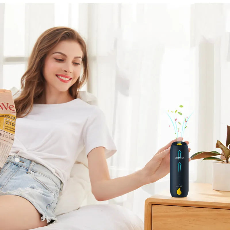 50ml columnar automatic spray aromatherapy diffuser with rechargeable battery and wall-mount option in green