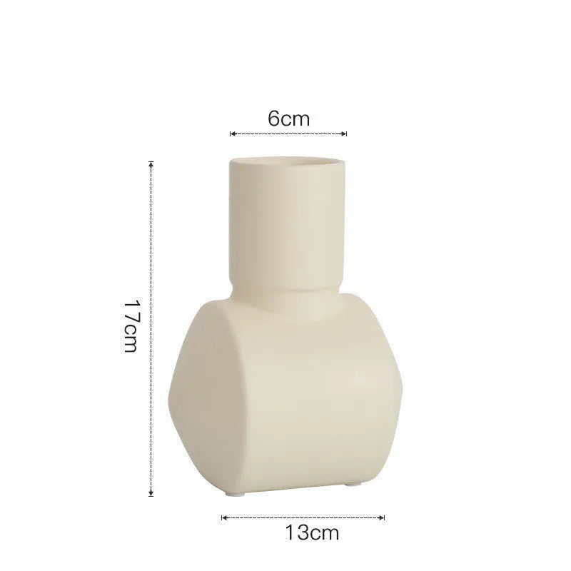 White ceramic hammer-shaped vase with Morandi colour glaze in beige, on a wooden surface.