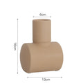 Nordic style simple hammer ceramic vase in Morandi beige, brown, or purple on a wooden cabinet.