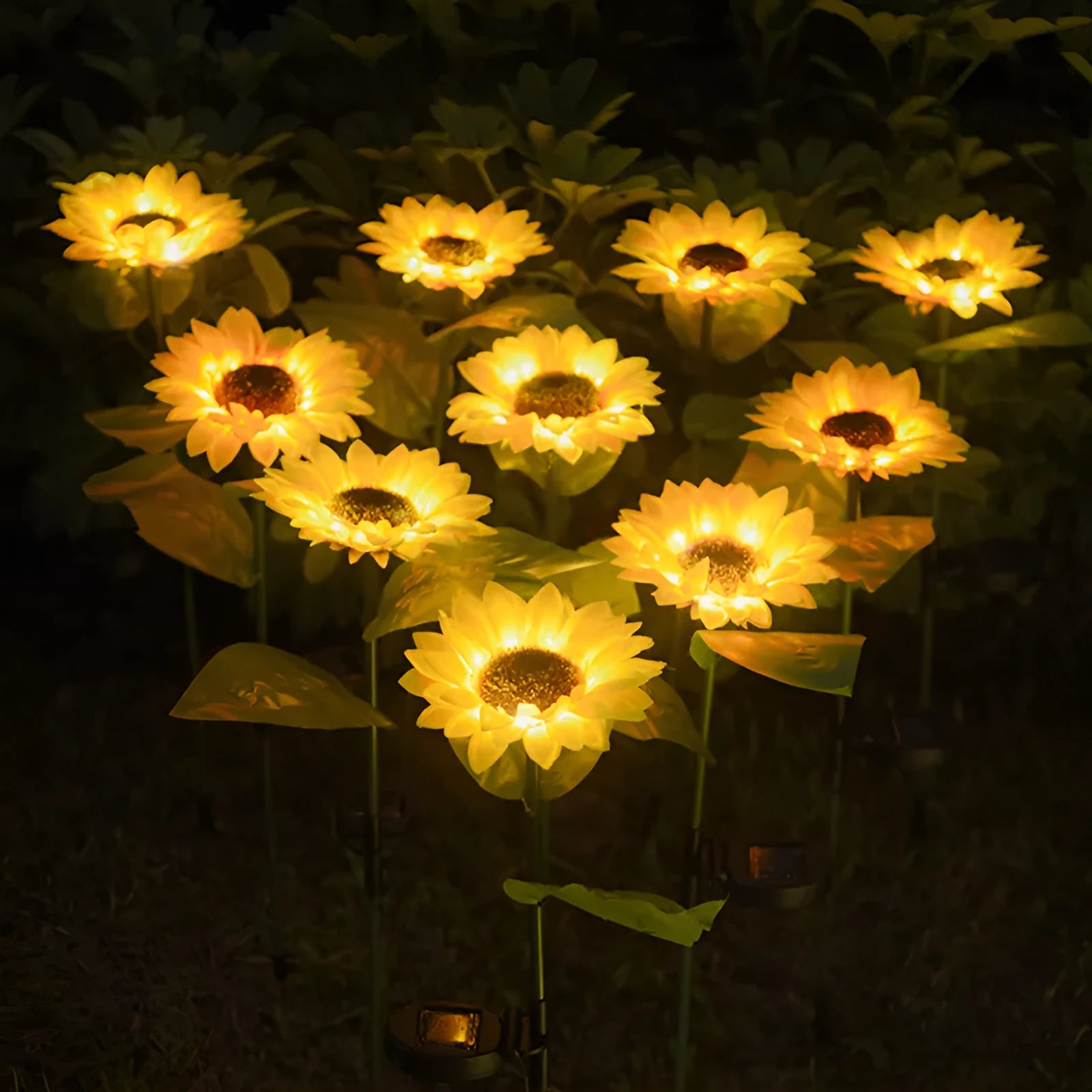 LED solar sunflower lamp with yellow fabric flower head, 66cm stainless steel stem, and ABS ground plug, placed on grass