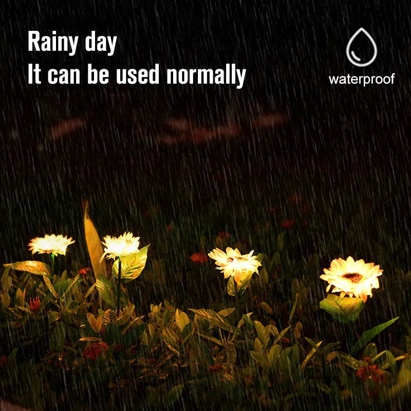 LED solar sunflower lamp with yellow fabric flower head, 66cm stainless steel stem, and ABS ground plug, placed on grass