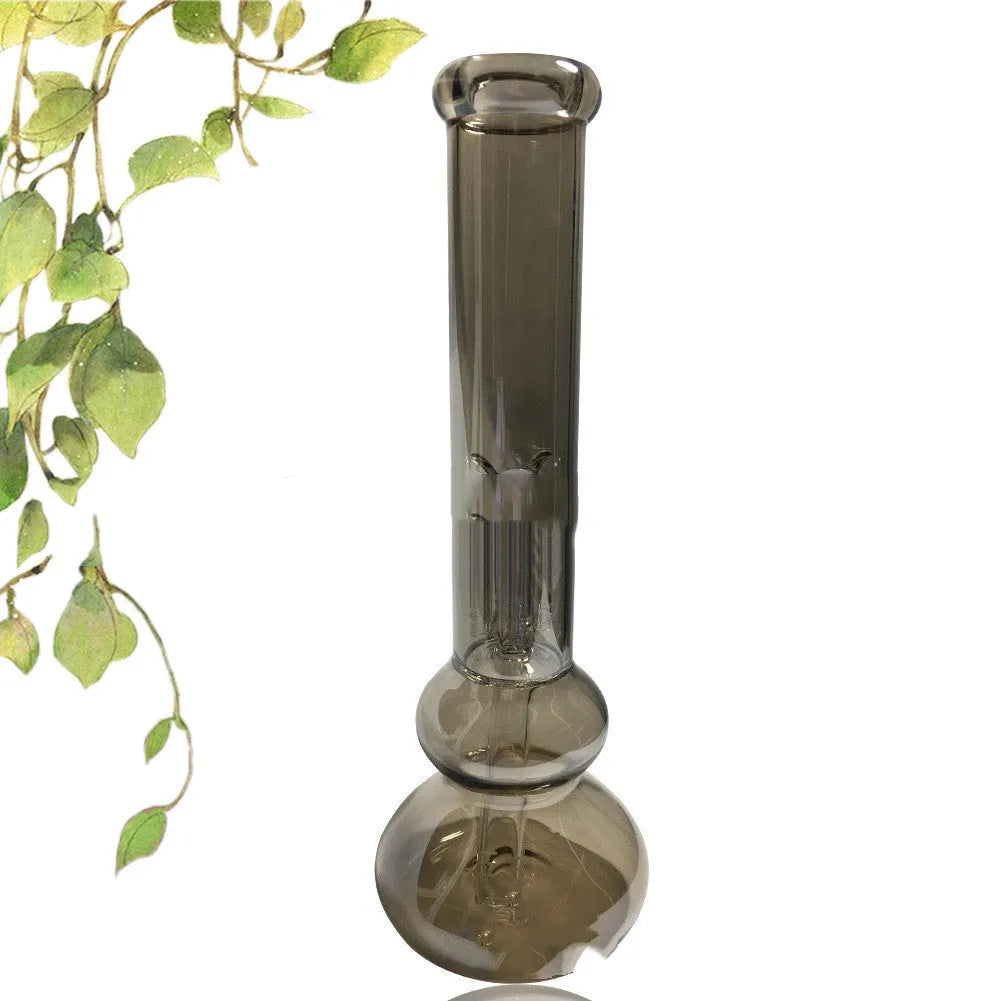 Set of pure colour geometric glass ornaments sitting on top of a clear vase.