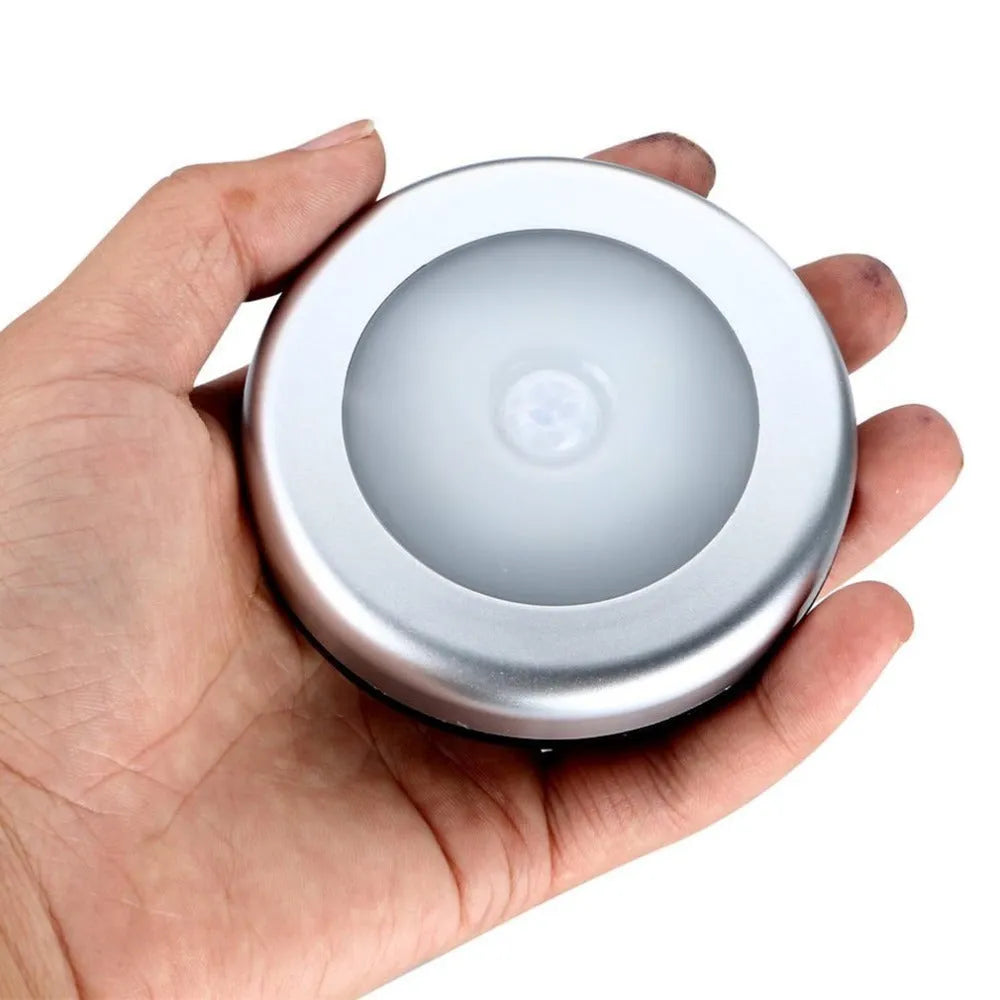 Silver wireless motion sensor night light with PC plastic lampshade measuring 80x80mm