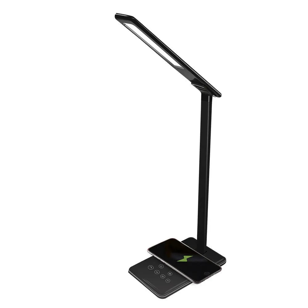 Black wireless charging LED desk lamp with touch control on a wooden desk