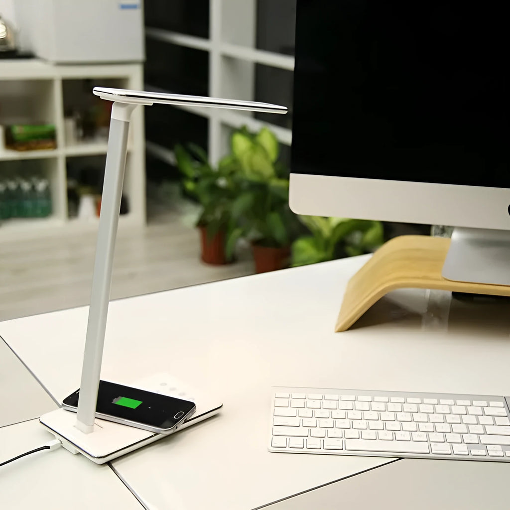Black wireless charging LED desk lamp with touch control on a wooden desk