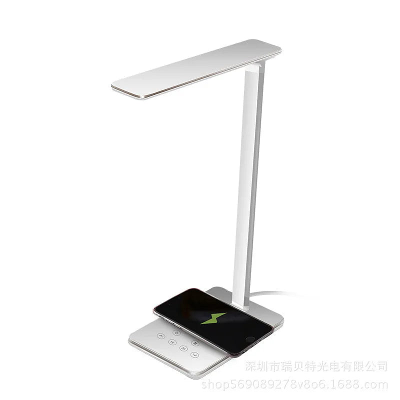Black wireless charging LED desk lamp with touch control on a wooden desk