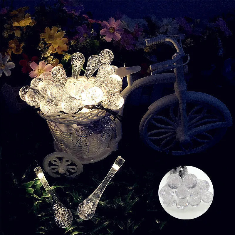 Solar-powered outdoor LED string lights with water drop pendants on 6.5 metre cable