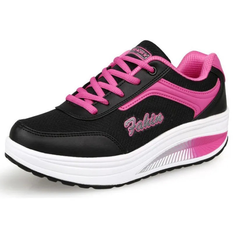 Women's heelless sports travel shoes in grey powder colour with a medium heel.