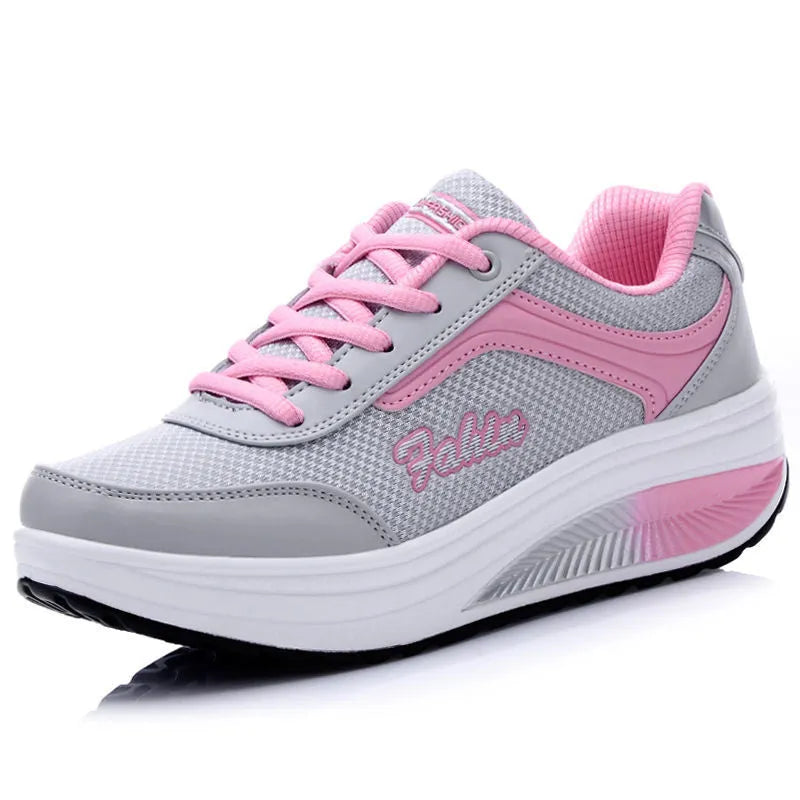 Women's heelless sports travel shoes in grey powder colour with a medium heel.