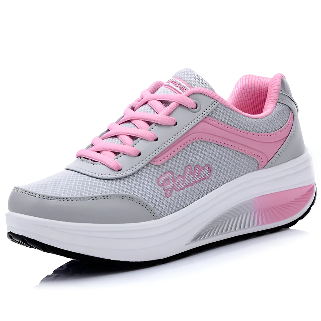 Women's heelless sports travel shoes in grey powder colour with a medium heel.