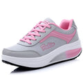 Women's heelless sports travel shoes in grey powder colour with a medium heel.