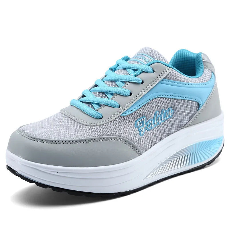 Women's heelless sports travel shoes in grey powder colour with a medium heel.