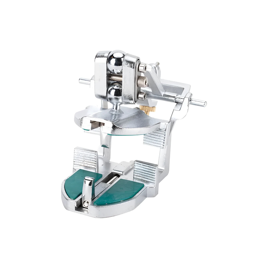 Korean-style adjustable dental articulator with incisal pins on a workbench.