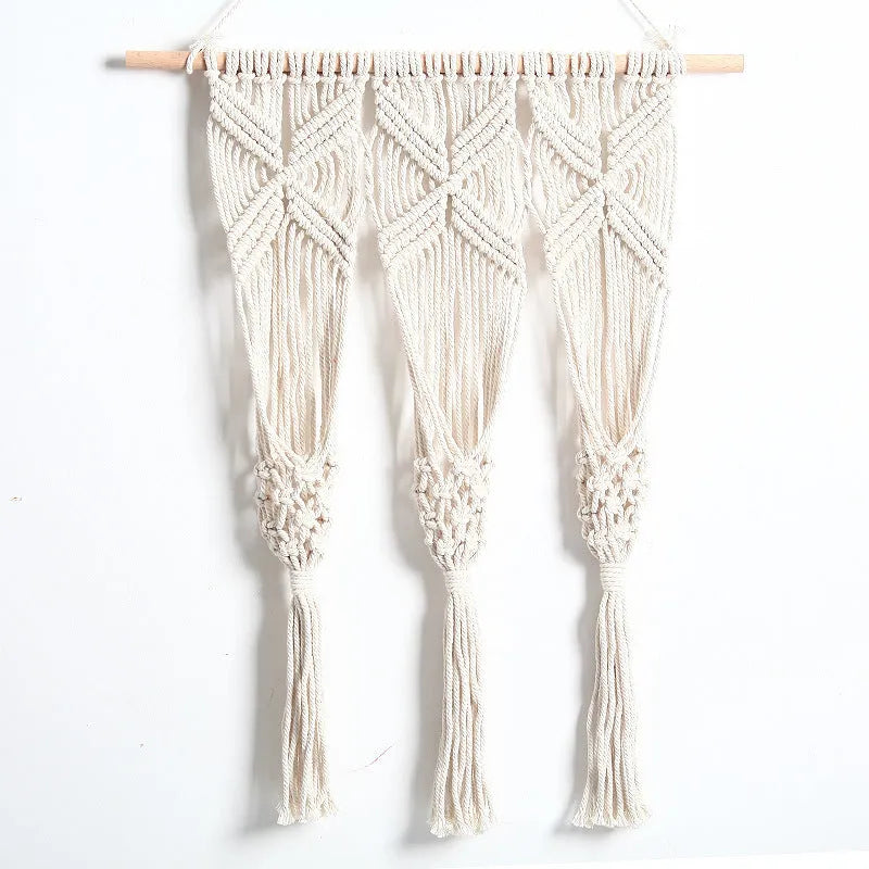 White hand-woven cotton rectangle tapestry 50x65cm with beech rod hung on wall showing grid pattern