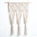 White hand-woven cotton rectangle tapestry 50x65cm with beech rod hung on wall showing grid pattern