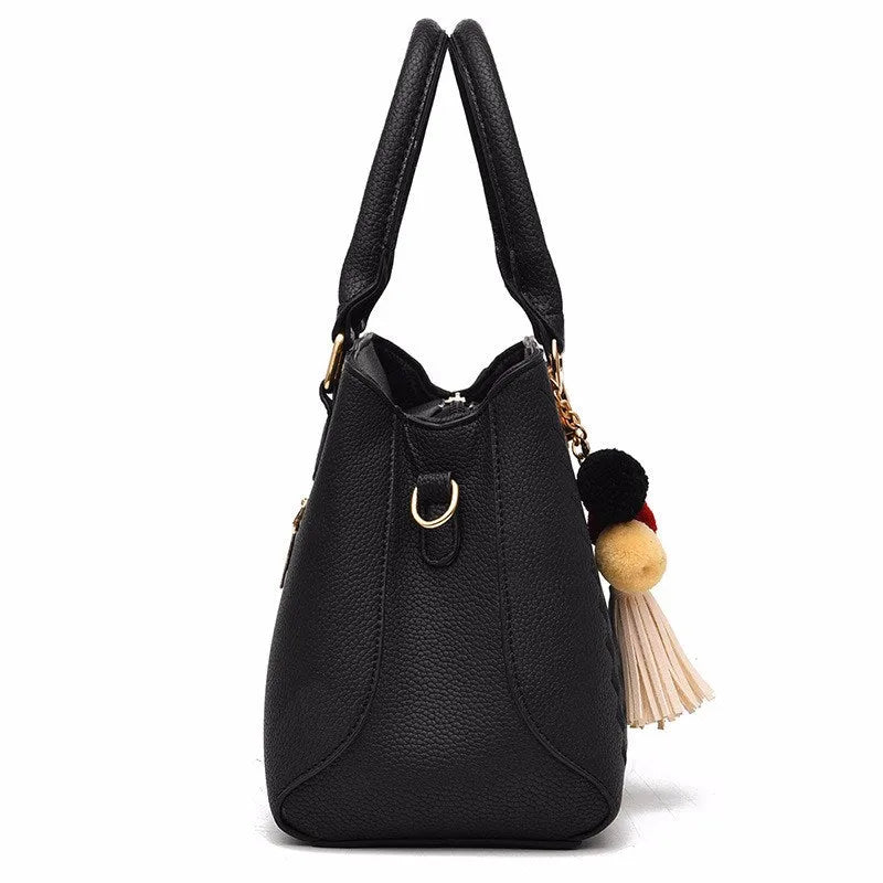 Ladies PU leather handbag 28cm x 12cm x 19cm with zip closure and 14cm handle, shown in available colours