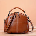 Round leather handbag with soft handle showing wine red, black, brown, coffee colour options