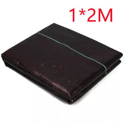 Black plastic weed-proof cloth laid on farmland soil for weed suppression