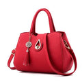 SMOOZA large PU leather tassel handbag with lock closure in beige