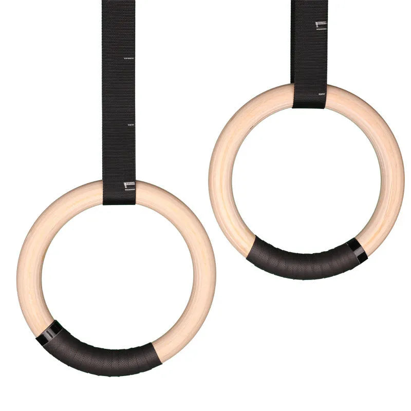 Birch wood gymnastic rings with nylon straps for calisthenics training