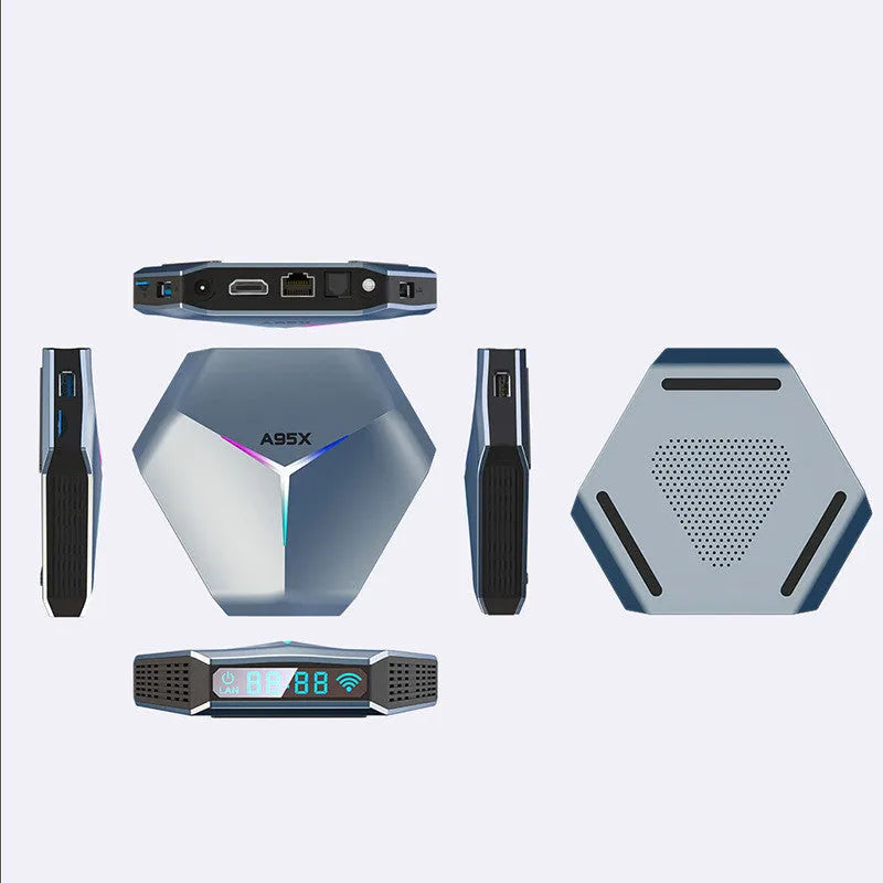 Android TV set-top box with remote control, HD cable, and power adapter on a table.