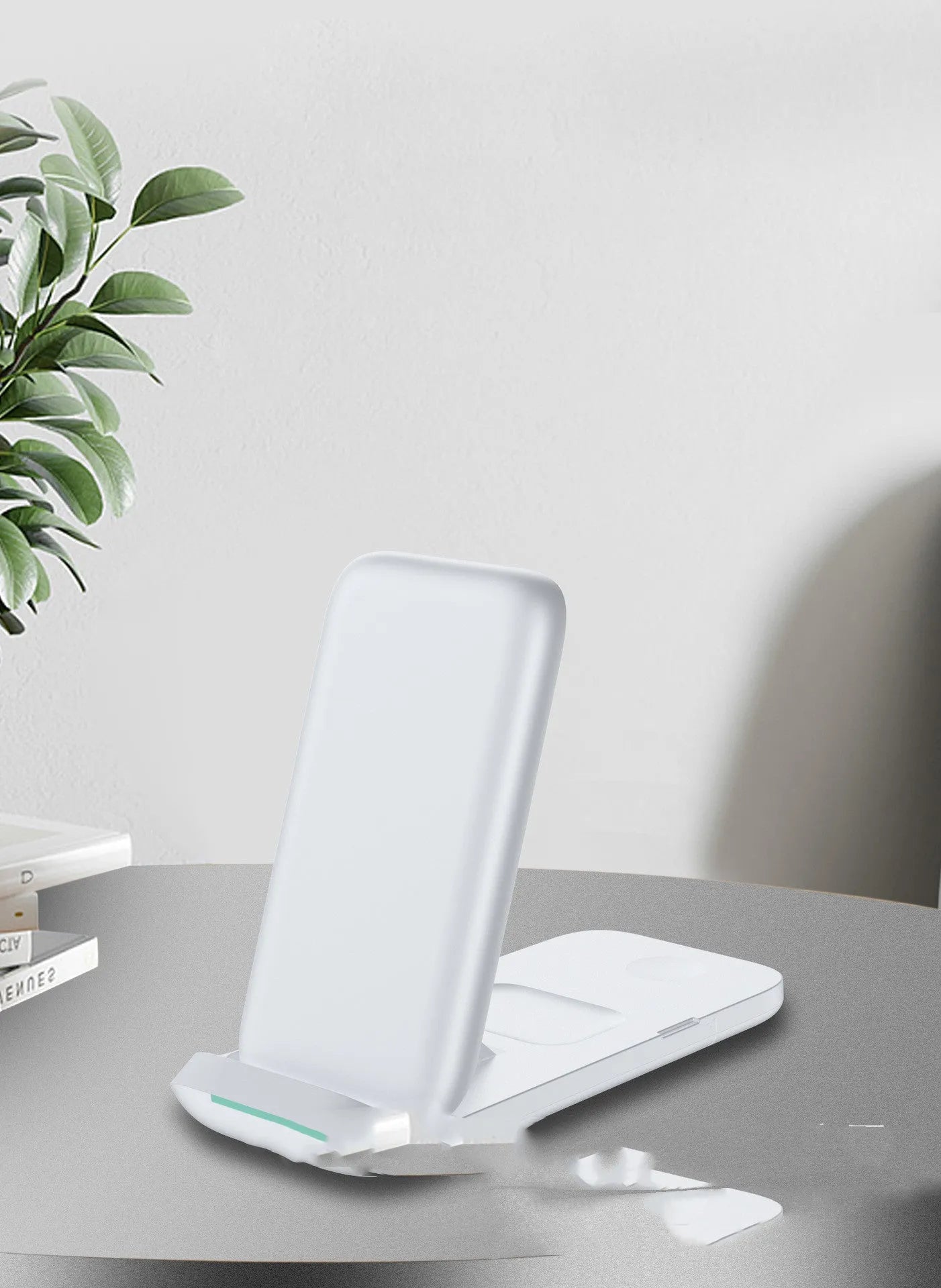 Black foldable wireless charger showing three devices charging simultaneously
