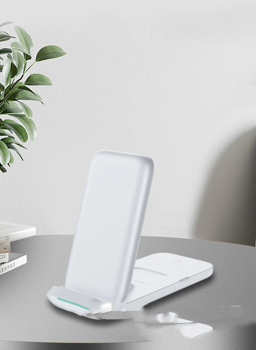 Black foldable wireless charger showing three devices charging simultaneously