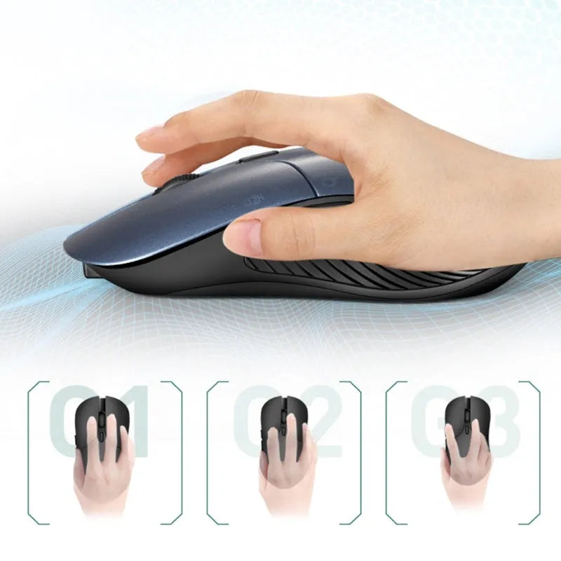 Blue wireless Smart Voice Mouse with voice control button on a desk next to a laptop.