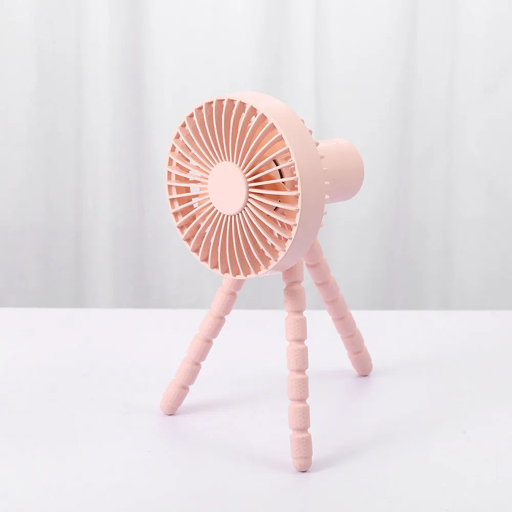 USB-powered portable desk fan with flexible tripod legs and a removable front cover, shown in white.