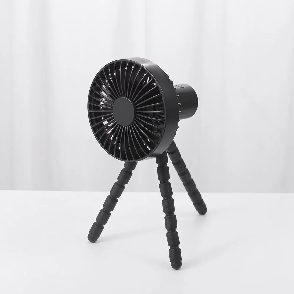 USB-powered portable desk fan with flexible tripod legs and a removable front cover, shown in white.