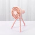 USB-powered portable desk fan with flexible tripod legs and a removable front cover, shown in white.