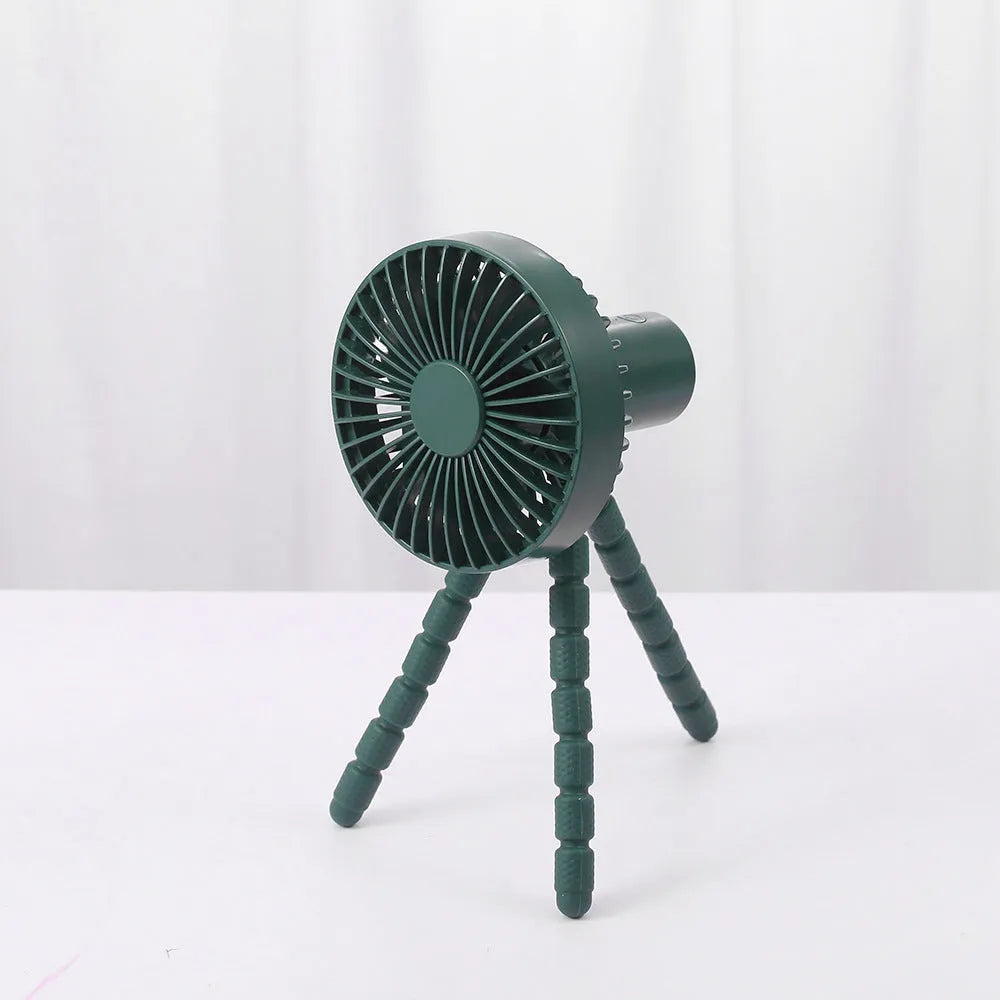 USB-powered portable desk fan with flexible tripod legs and a removable front cover, shown in white.