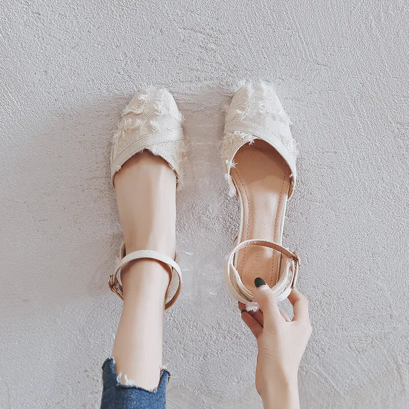 Women's apricot suede flats with an ankle strap and a 3cm low rubber sole.
