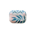 Blue TPU AirPods case with painted tropical banana leaf design, shown next to a green variant.