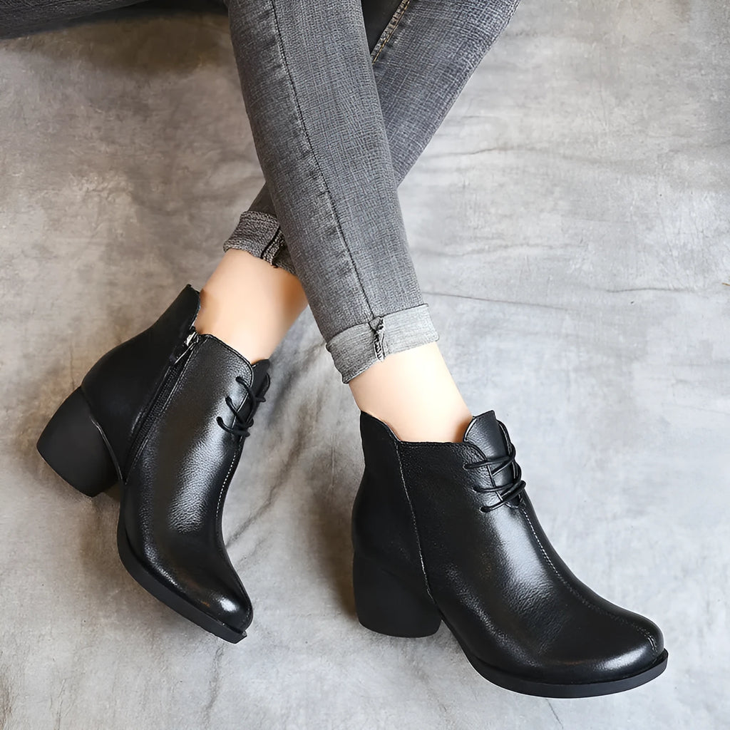 Women's black vintage-style leather Martin boots with thick rubber sole and round toe