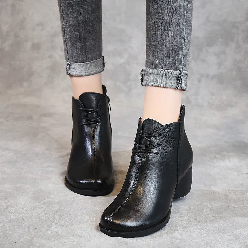 Women's black vintage-style leather Martin boots with thick rubber sole and round toe