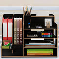 Wooden desktop organiser with multi-layer partitions for books, stationery, and tissues in a dormitory setting