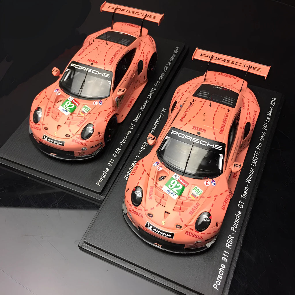 Pink 1:64 scale resin Porsche supercar model body, approx. 7 x 3.2 x 2 cm, with 10 x 4 x 3.5 cm display box