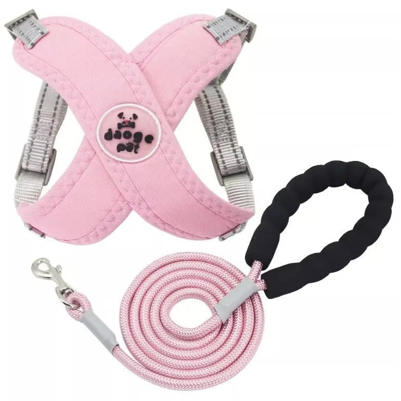 Blue polyester dog vest with an attached hand-holding lead, shown on a model dog.