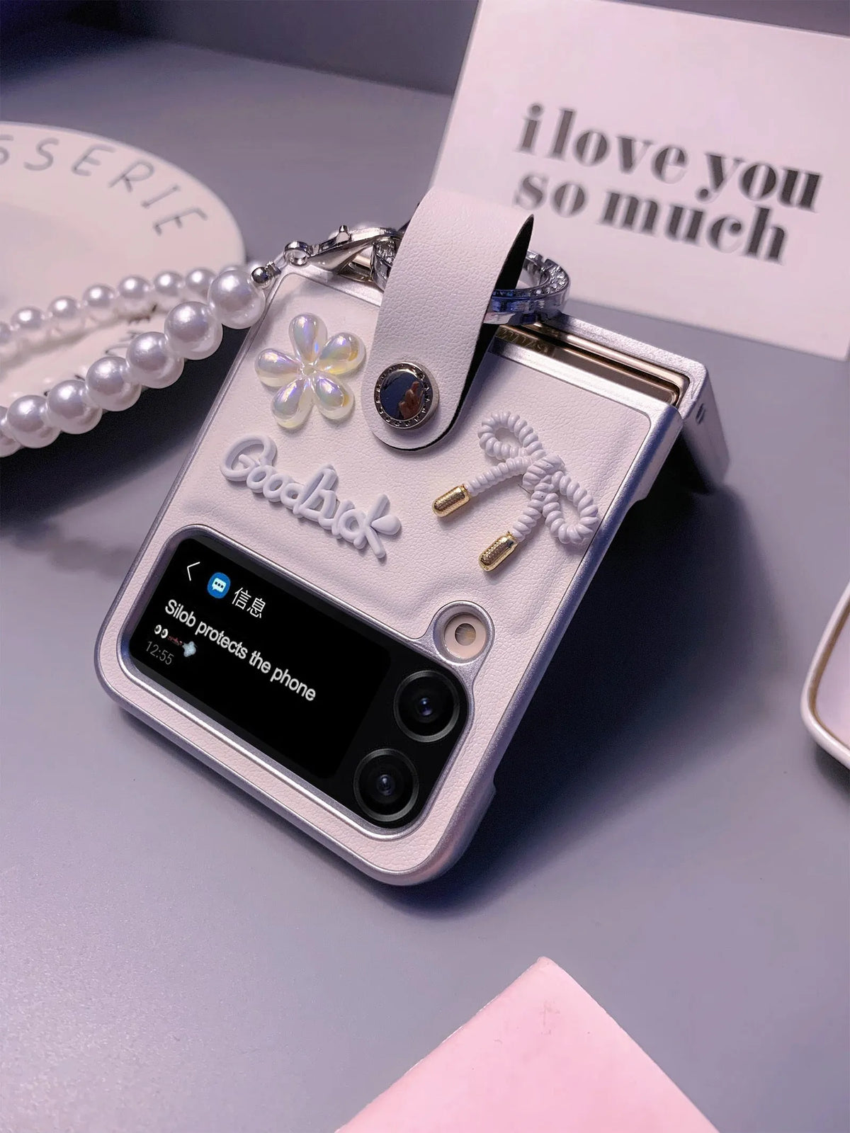 Ultra thin faux leather folding phone case for Samsung Galaxy Z Flip with white silver border, flower bow and bracelet