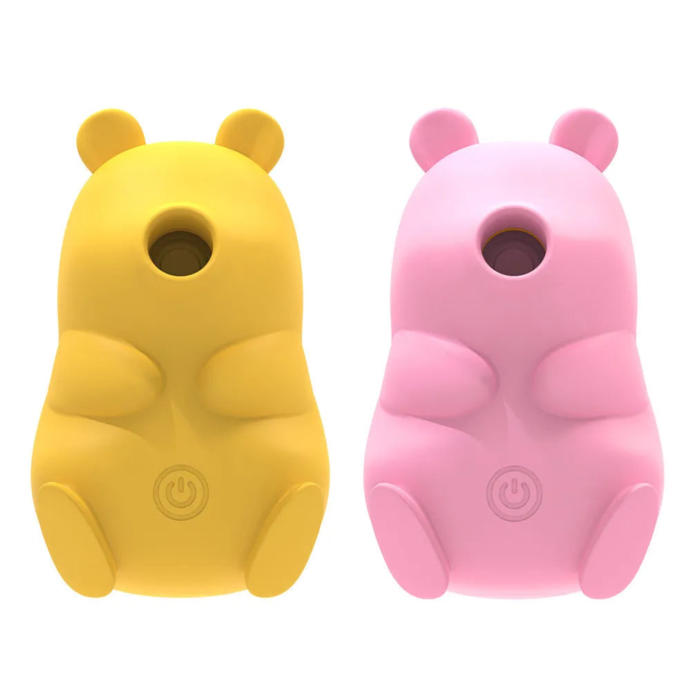 Cute bear-shaped silicone suction massage device in pink and yellow with magnetic charging cable