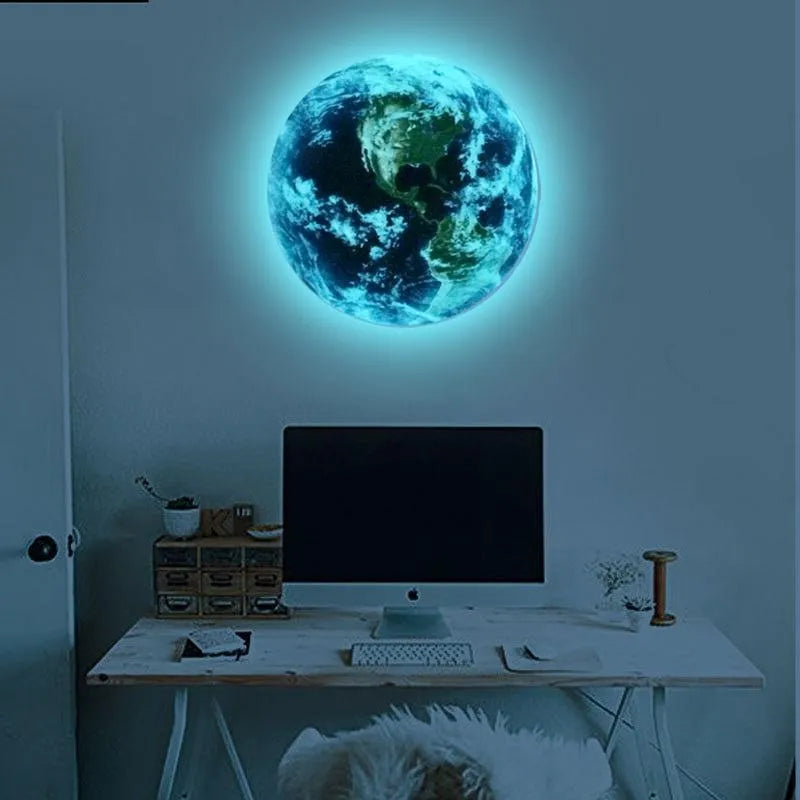 Glow in the dark 3D Earth planet wall sticker in three size options on a dark blue background.