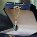 Gold geometric pendant necklace on a chain, showcasing a retro French-inspired copper design.
